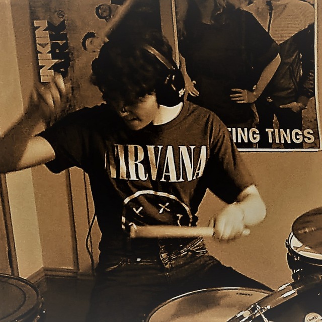 Image of Evie playing the drums